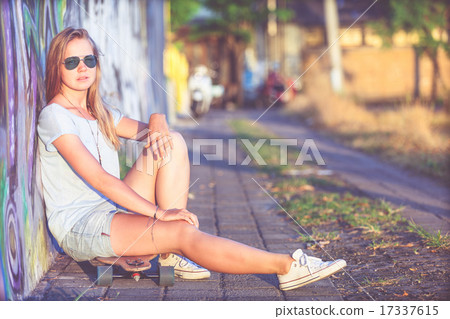 Fashion lifestyle, Beautiful young blonde woman with skateboard 17337615