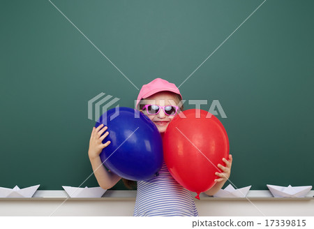 girl with balloon near school board 17339815