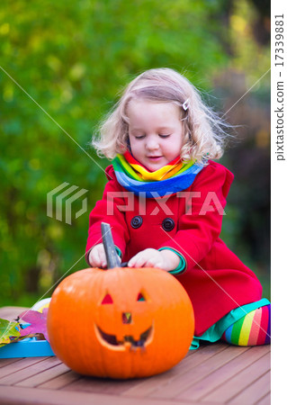Kids carving pumpkin at Halloween Kids carving pumpkin at Halloween 17339881