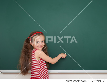Schoolgirl write on school board 17339937