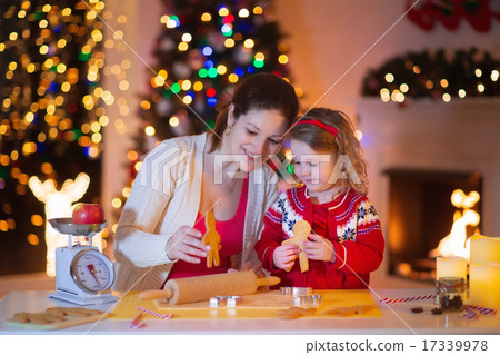 Mother and daughter baking gingerbread for Christmas dinner Mother and daughter baking gingerbread for Christmas dinner 17339978