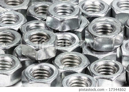 Closeup metal screw and nuts on white background. 17344802