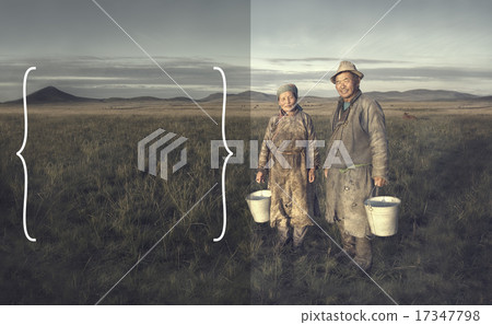 Mongolian Couple Farmers Holding Basin And Posing In The Field 17347798