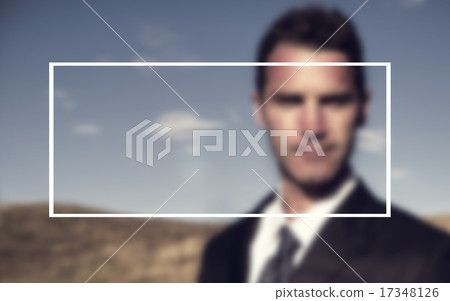 Businessman Standing Outdoors Staring Directly At The Camera 17348126