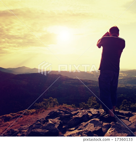 Professional photographer  takes photos 17360133