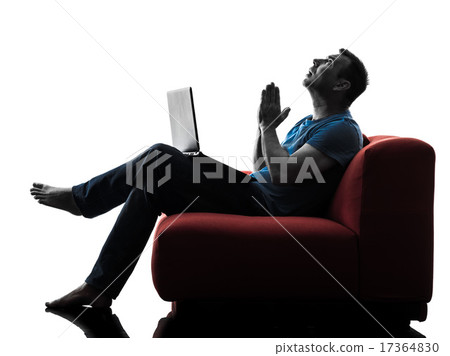 man sofa couch computer computing laptop praying 17364830