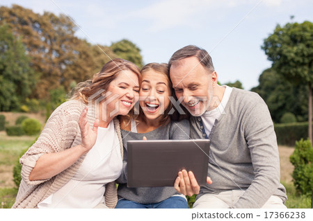 Beautiful girl is showing tablet to her old parents Beautiful girl is showing tablet to her old parents 17366238
