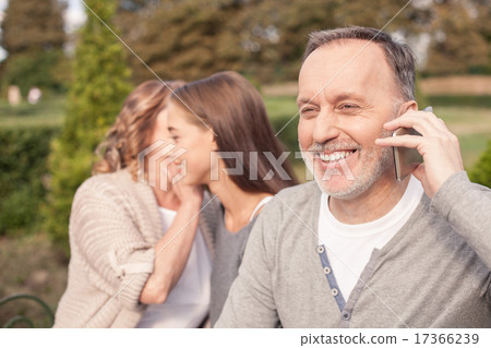 Cute family is resting together in park 17366239