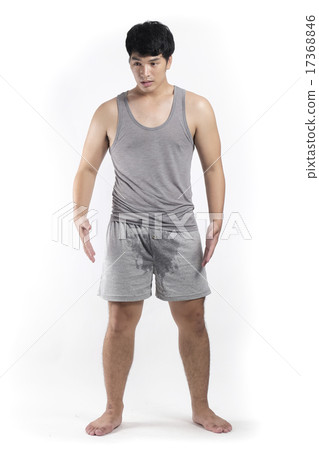 Asian man in grey pajamas with wet crotch Asian man in grey pajamas with wet crotch 17368846