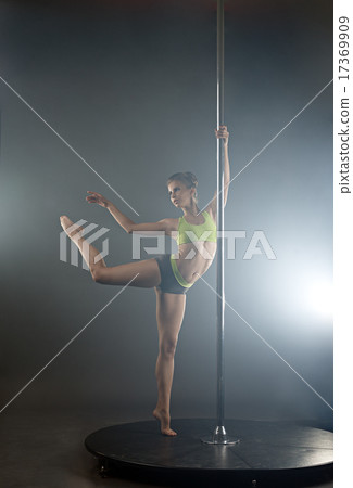 Graceful pole dancer in rays of spotlights Graceful pole dancer in rays of spotlights 17369909