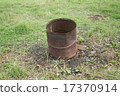 Rusty iron barrel in the field 17370914