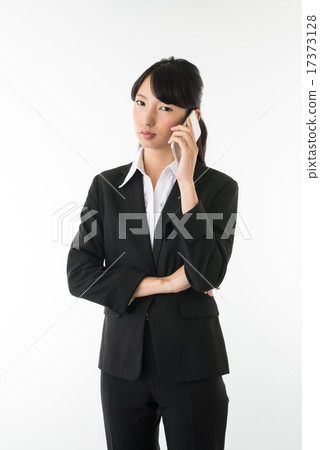 Business woman talking on mobile phone Business woman talking on mobile phone 17373128