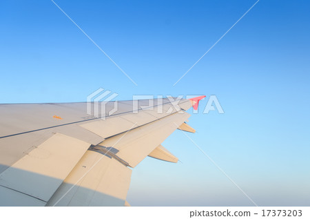 Sun shines on airplane wing on the morning Sun shines on airplane wing on the morning 17373203