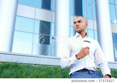 Busy businessman  drinking coffee 17373827