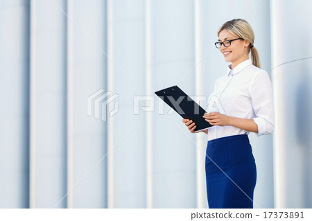 Cheerful business woman holding folder  17373891