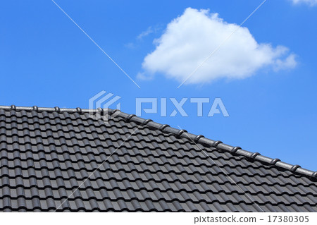 tile roof on a new house with blue sky tile roof on a new house with blue sky 17380305