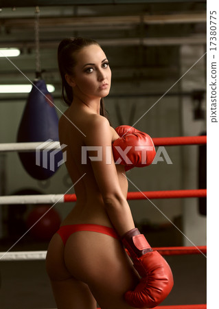 Shot of beautiful topless brunette on boxing ring 17380775