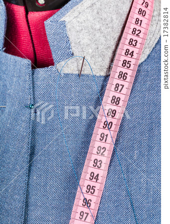 tailoring of collar for blue jacket on dummy 17382814