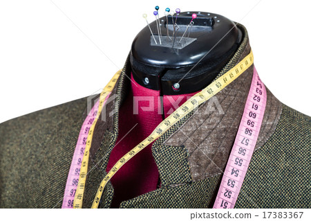 tailoring of male green tweed jacket on mannequin 17383367