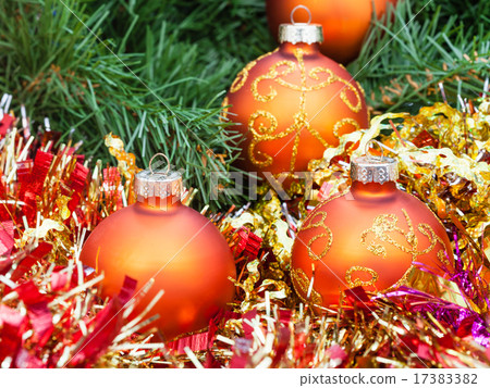 orange Christmas balls, red tinsel on Xmas tree 3 17383382