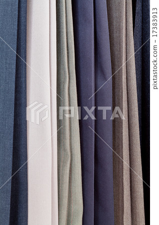 row of various woolen pants in tailoring atelier 17383913
