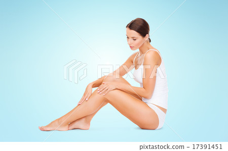 beautiful woman in cotton underwear touching legs 17391451
