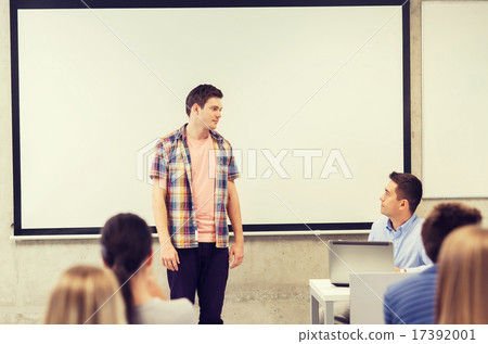 group of students and teacher in classroom 17392001