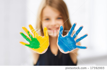 girl showing painted hands 17392003