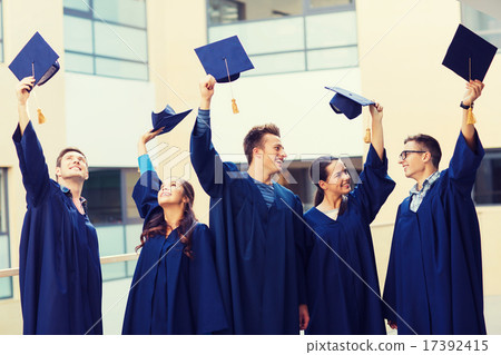 group of smiling students in mortarboards 17392415