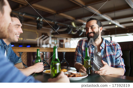 happy male friends drinking beer at bar or pub 17392819