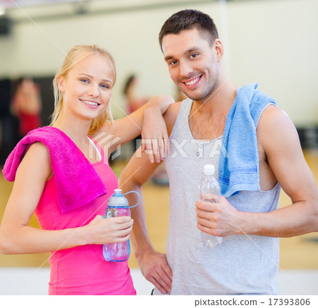 two smiling people in the gym 17393806