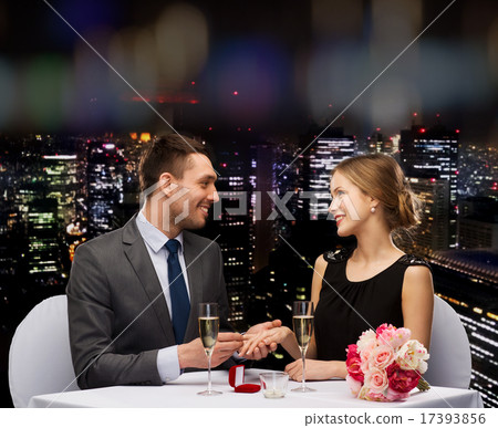 man proposing to his girlfriend at restaurant man proposing to his girlfriend at restaurant 17393856