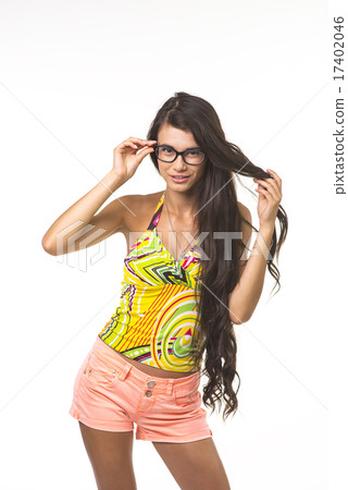 Pretty lady is touching her glasses. 17402046