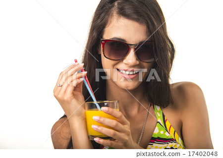 Pretty lady with orange juice.  17402048