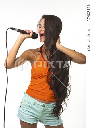 Pretty lady in orange shirt. 17402118