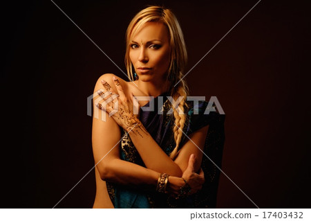 Woman with traditional mehndi henna ornament wearing sari 17403432