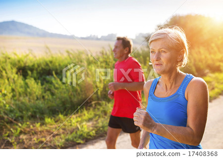 Stock Photo: Senior couple running