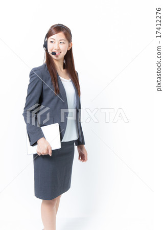 A female operator holding an iPad under his arm 17412276