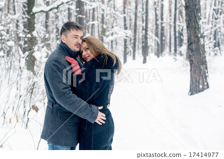 Portrait of happy couple in winter park Portrait of happy couple in winter park 17414977