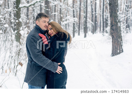 Portrait of happy couple in winter park 17414983
