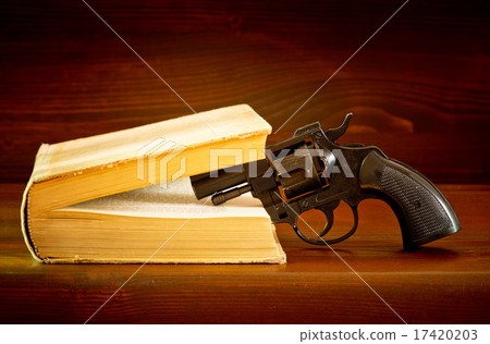 book with handgun book with handgun 17420203