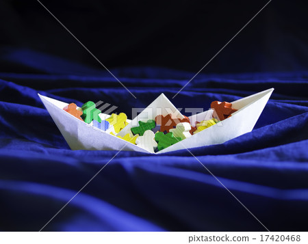 Immigration emigration migration concept, paperboat with meeples Immigration emigration migration concept, paperboat with meeples 17420468