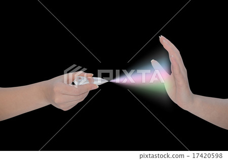 Hand holding Vogel wand-crystal healing tool 17420598