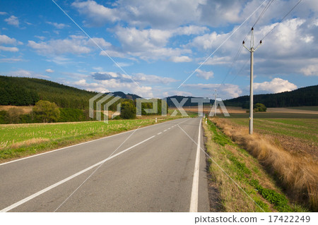 On the empty road between  field 17422249