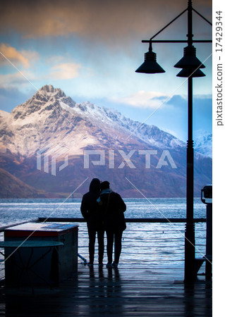 silhouette of couples at wakatipu lake view point silhouette of couples at wakatipu lake view point 17429344
