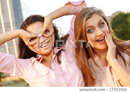Two cheerful girls fooling around 17433932