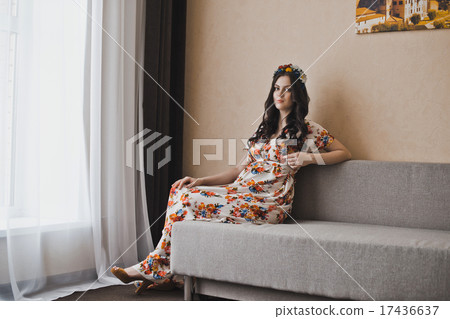 The pregnant woman lies on a sofa 2135. The pregnant woman lies on a sofa 2135. 17436637