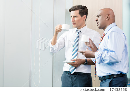 Asian and Caucasian business man having coffee Asian and Caucasian business man having coffee 17438568