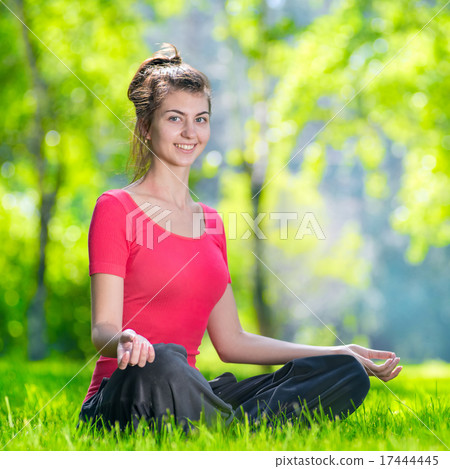 Young woman doing yoga exercises 17444445