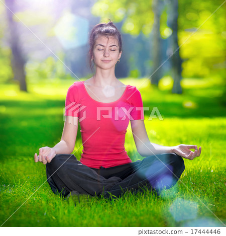 Young woman doing yoga exercises 17444446